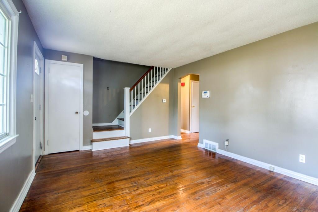 111 Breckwood Boulevard Springfield, MA 01109 - Photo 13 of 25 a view of an empty room with wooden floor and a window