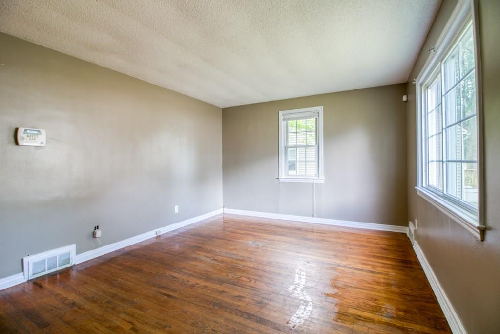 111 Breckwood Boulevard Springfield, MA 01109 - Photo 14 of 25 a view of an empty room with wooden floor and a window