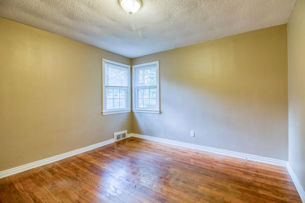 111 Breckwood Boulevard Springfield, MA 01109 - Photo 20 of 25 a view of empty room with wooden floor and fan