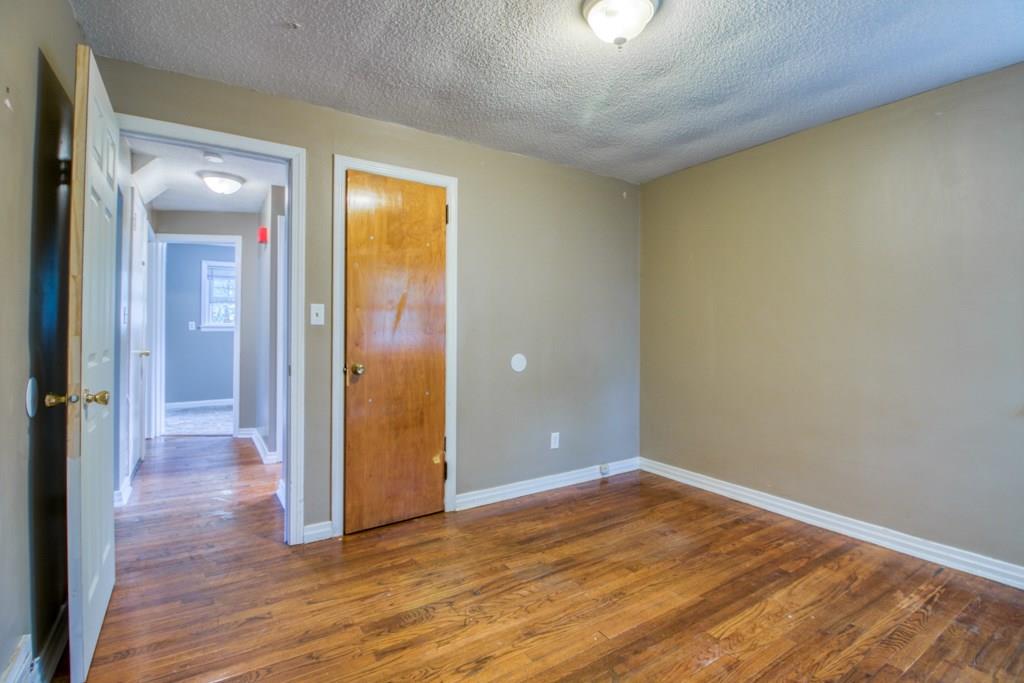 111 Breckwood Boulevard Springfield, MA 01109 - Photo 21 of 25 wooden floor in an empty room with a window