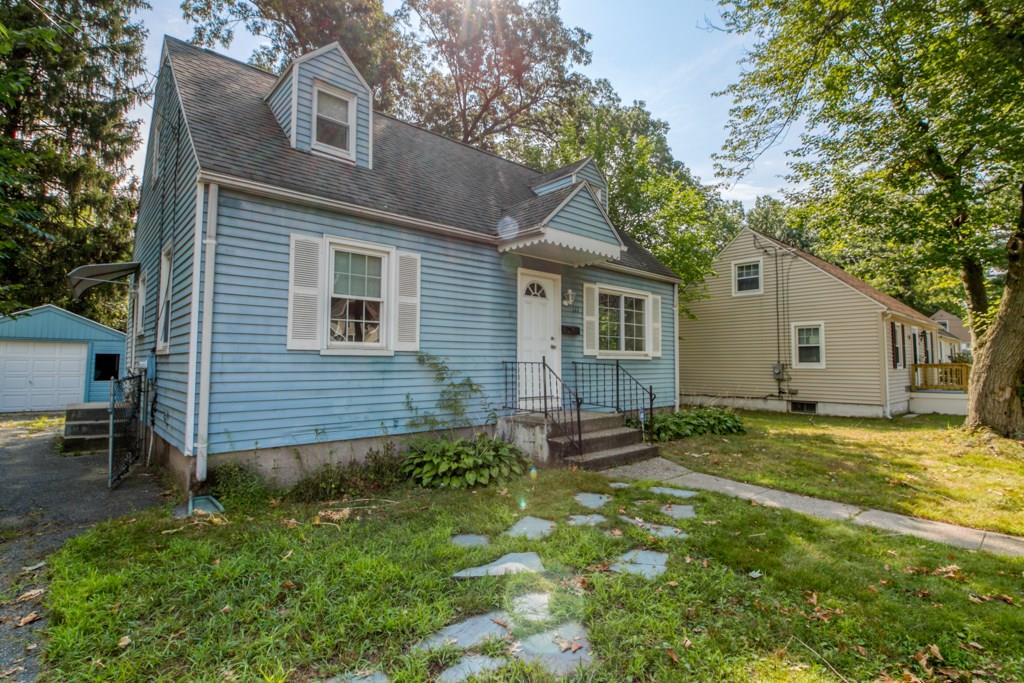111 Breckwood Boulevard Springfield, MA 01109 - Photo 3 of 25 a backyard of a house with table and chairs