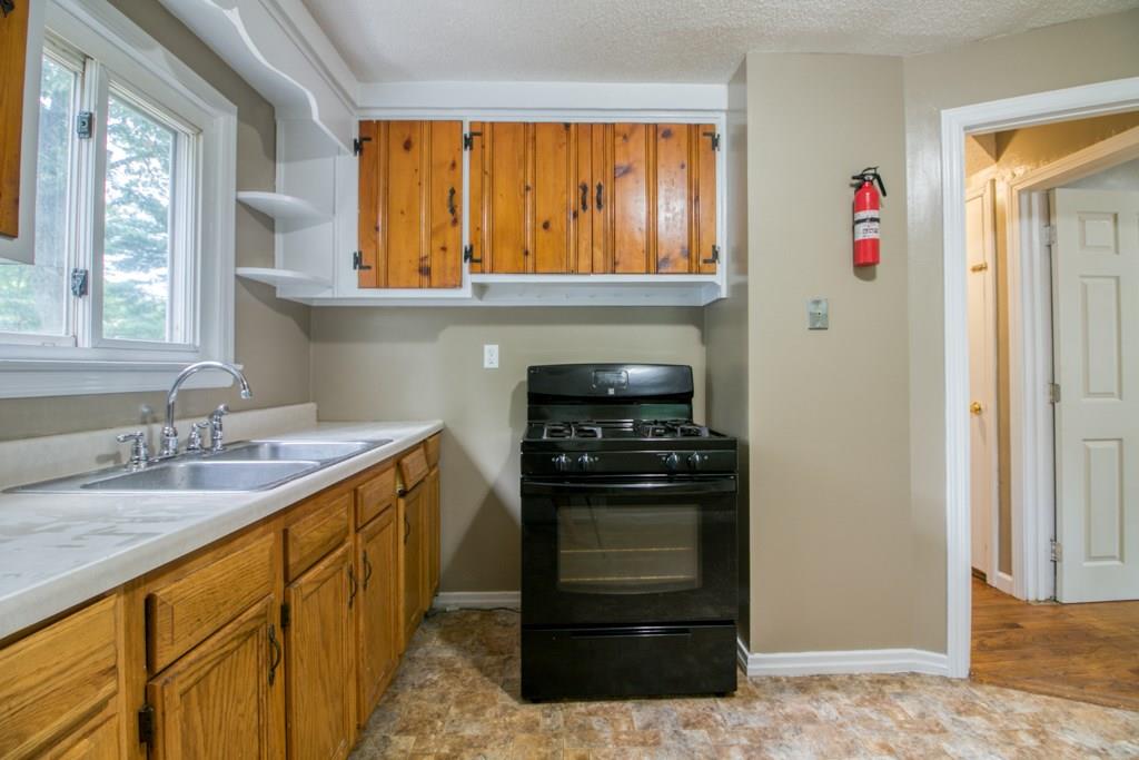 111 Breckwood Boulevard Springfield, MA 01109 - Photo 9 of 25 a kitchen with a stove and a sink