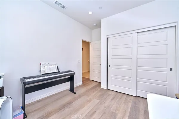 a view of room with wooden floor