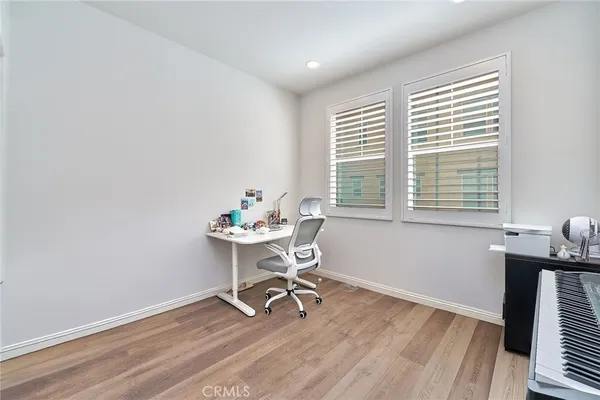 a workspace with furniture and a window