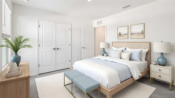 a spacious bedroom with a bed and a window