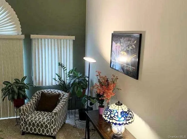 a outdoor living room with furniture and a chandelier
