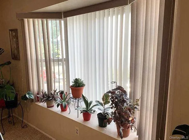 a view of a living room and dining room