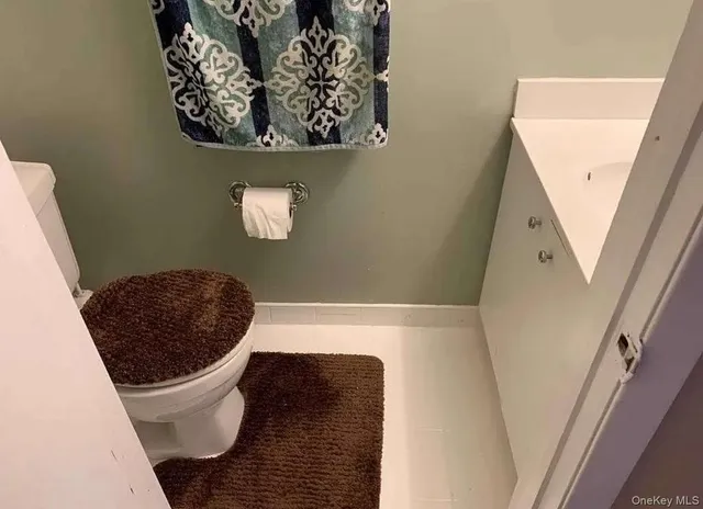 a bathroom with a toilet and a tub