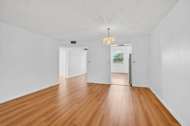 a kitchen with stainless steel appliances granite countertop a stove and a refrigerator