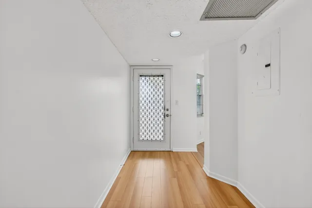 a view of a livingroom with wooden floor