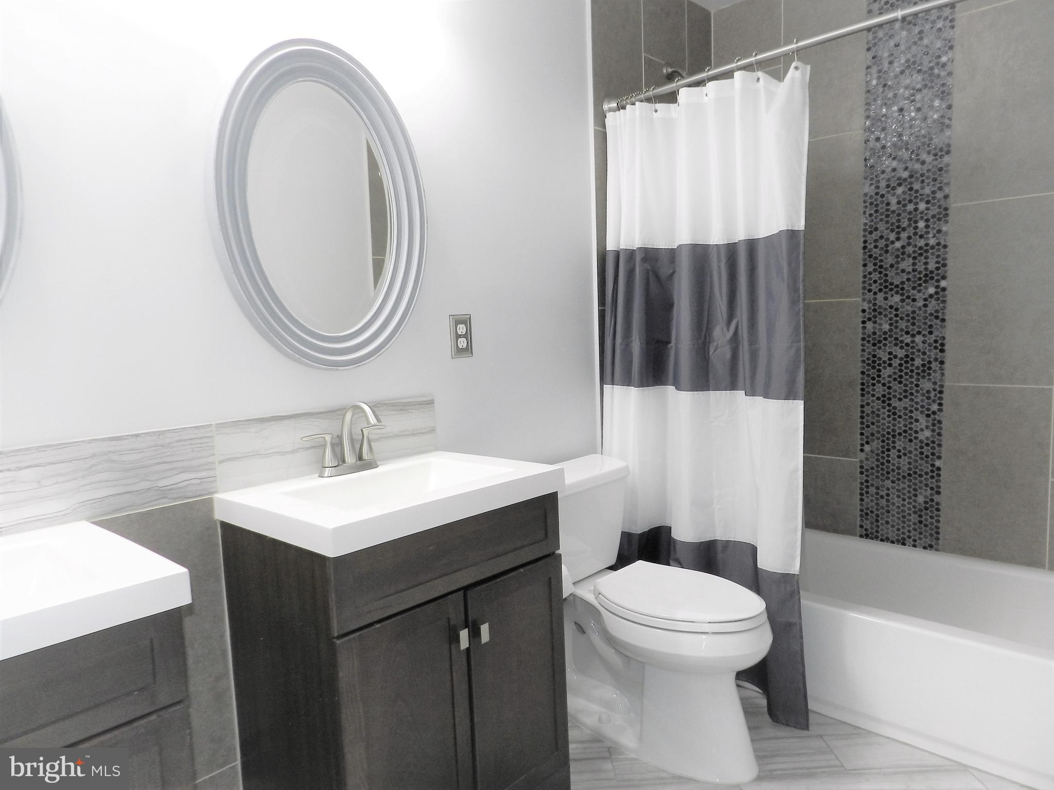 479 Blossom Tree Road Culpeper, VA 22701 - Photo 23 of 30 a bathroom with a sink a toilet and a mirror