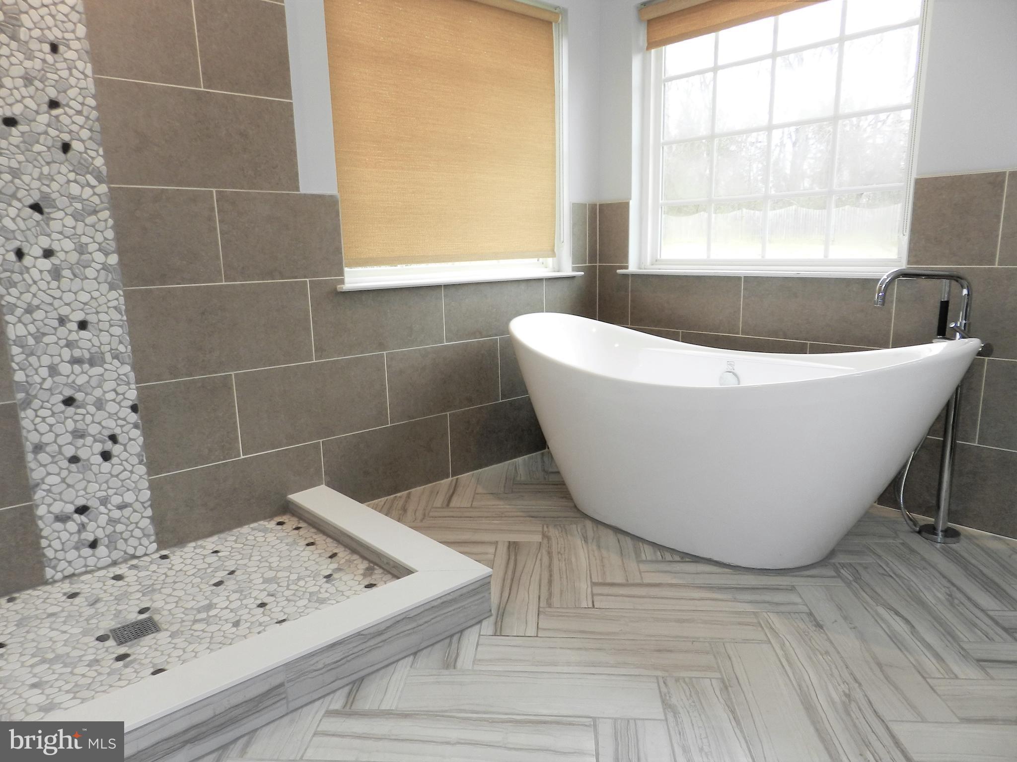 479 Blossom Tree Road Culpeper, VA 22701 - Photo 4 of 30 a view of a bathtub in a bathroom