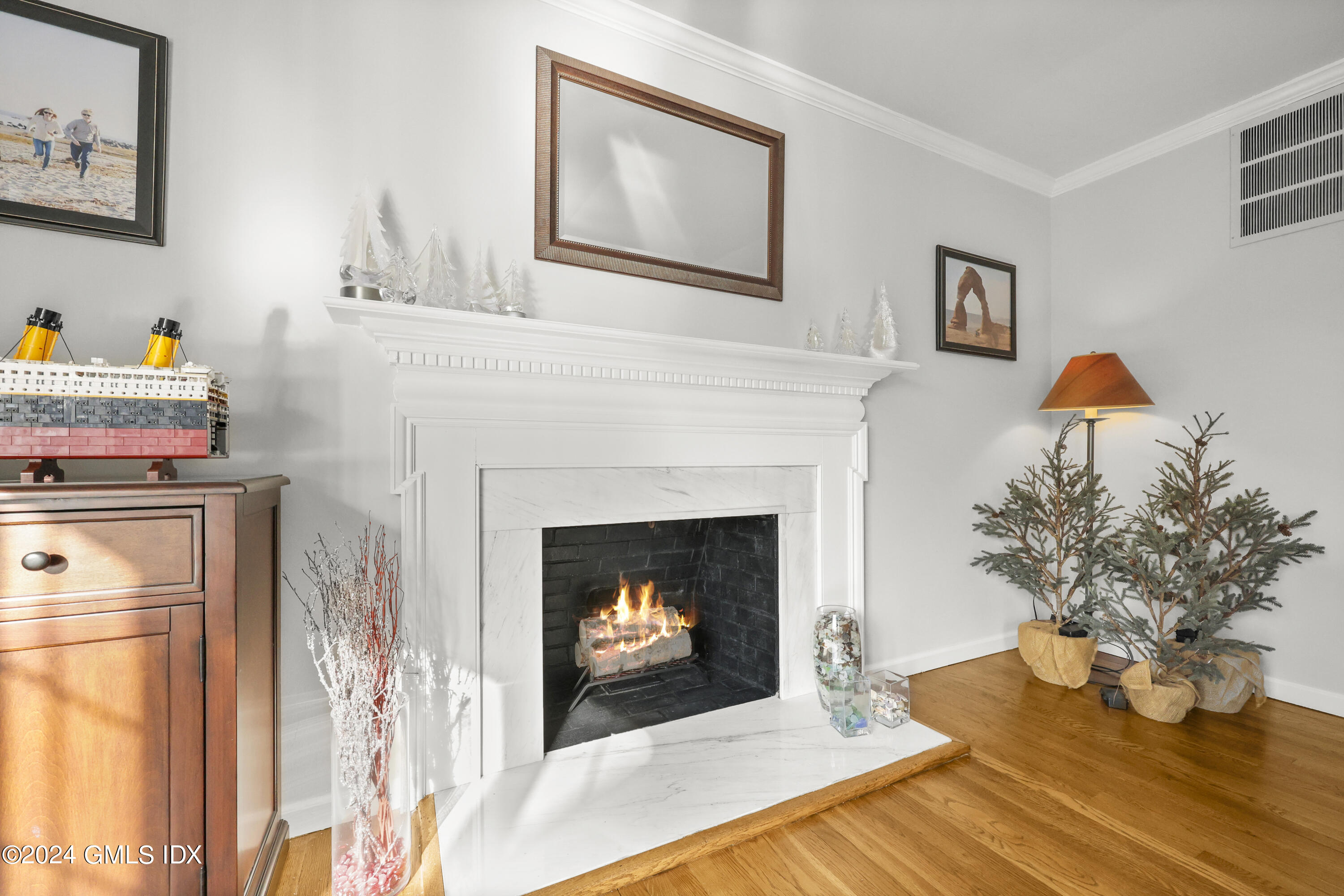 34 Loading Rock Road Riverside, CT 06878 - Photo 11 of 41 a living room with furniture and a fireplace