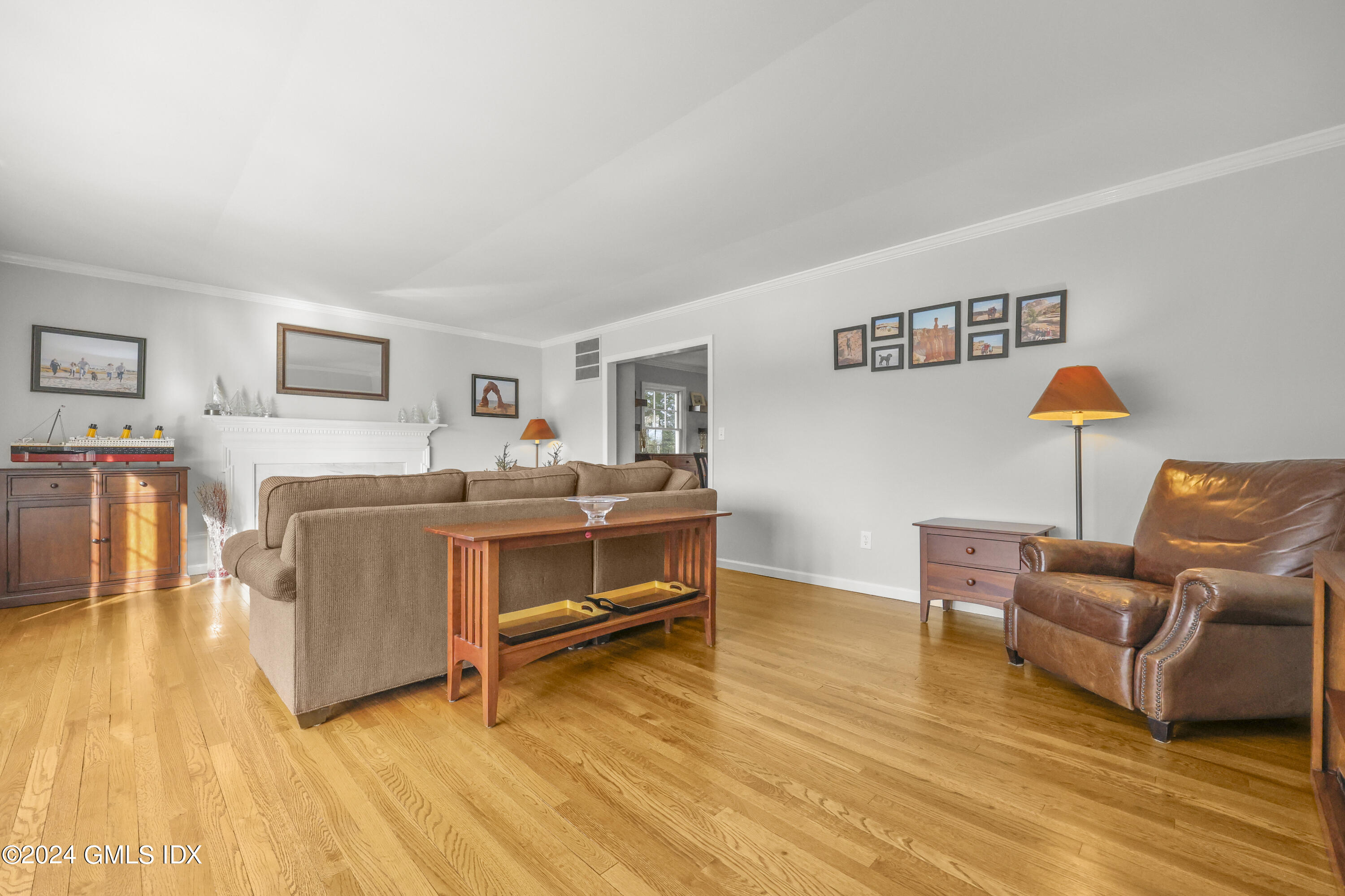 34 Loading Rock Road Riverside, CT 06878 - Photo 12 of 41 a bedroom with furniture and a wooden floor