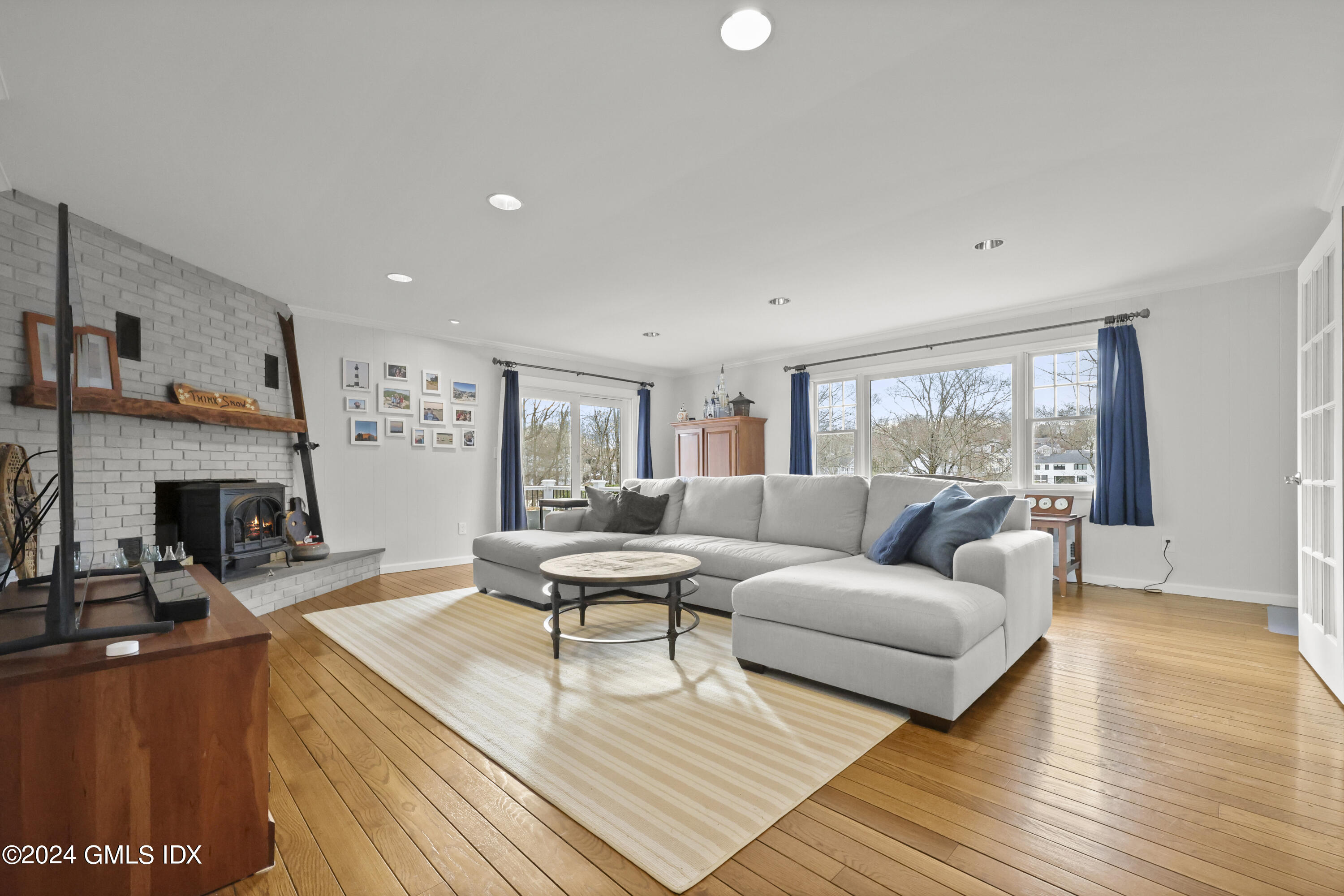 34 Loading Rock Road Riverside, CT 06878 - Photo 14 of 41 a living room with furniture and a fireplace