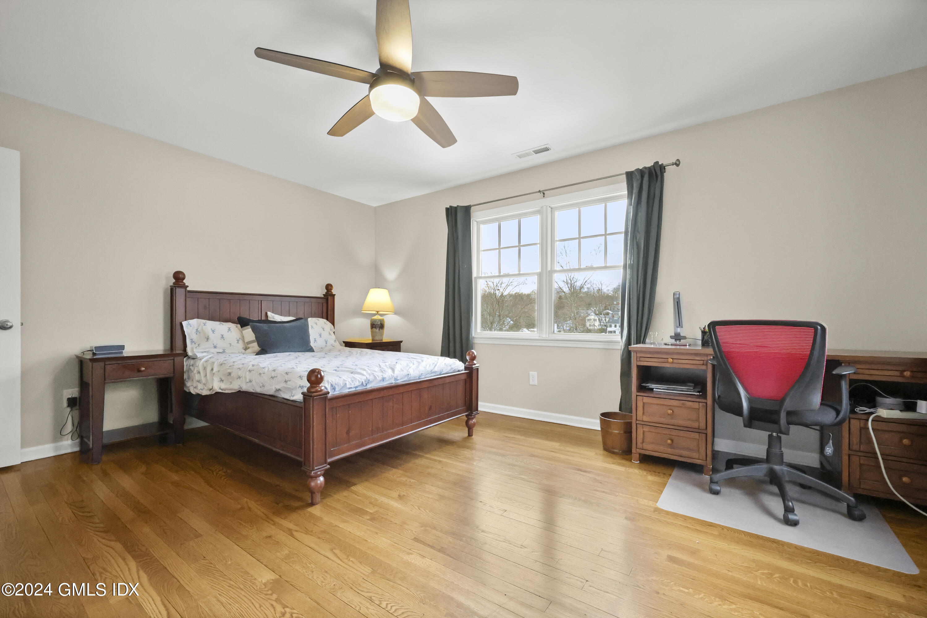 34 Loading Rock Road Riverside, CT 06878 - Photo 20 of 41 a bedroom with a bed chair and window