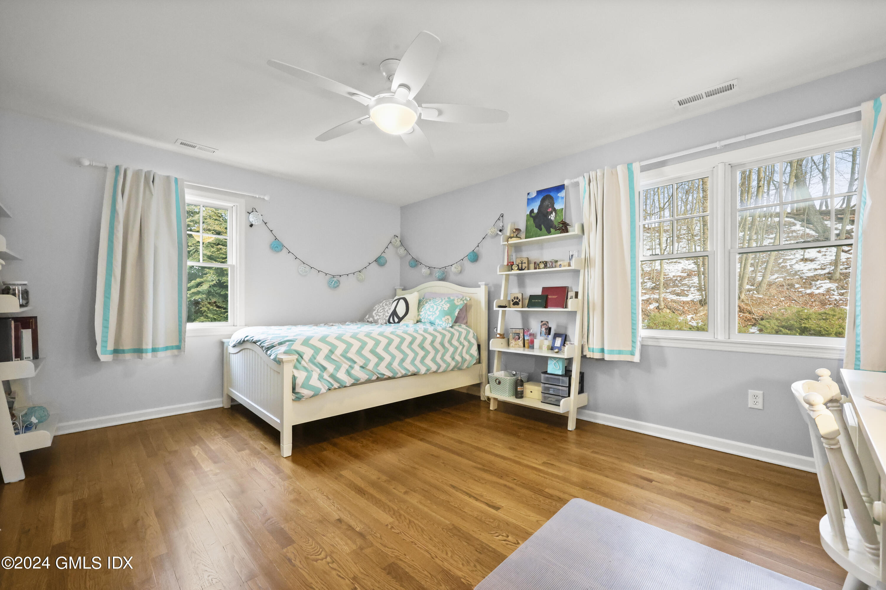 34 Loading Rock Road Riverside, CT 06878 - Photo 22 of 41 a bedroom with furniture and a wooden floor