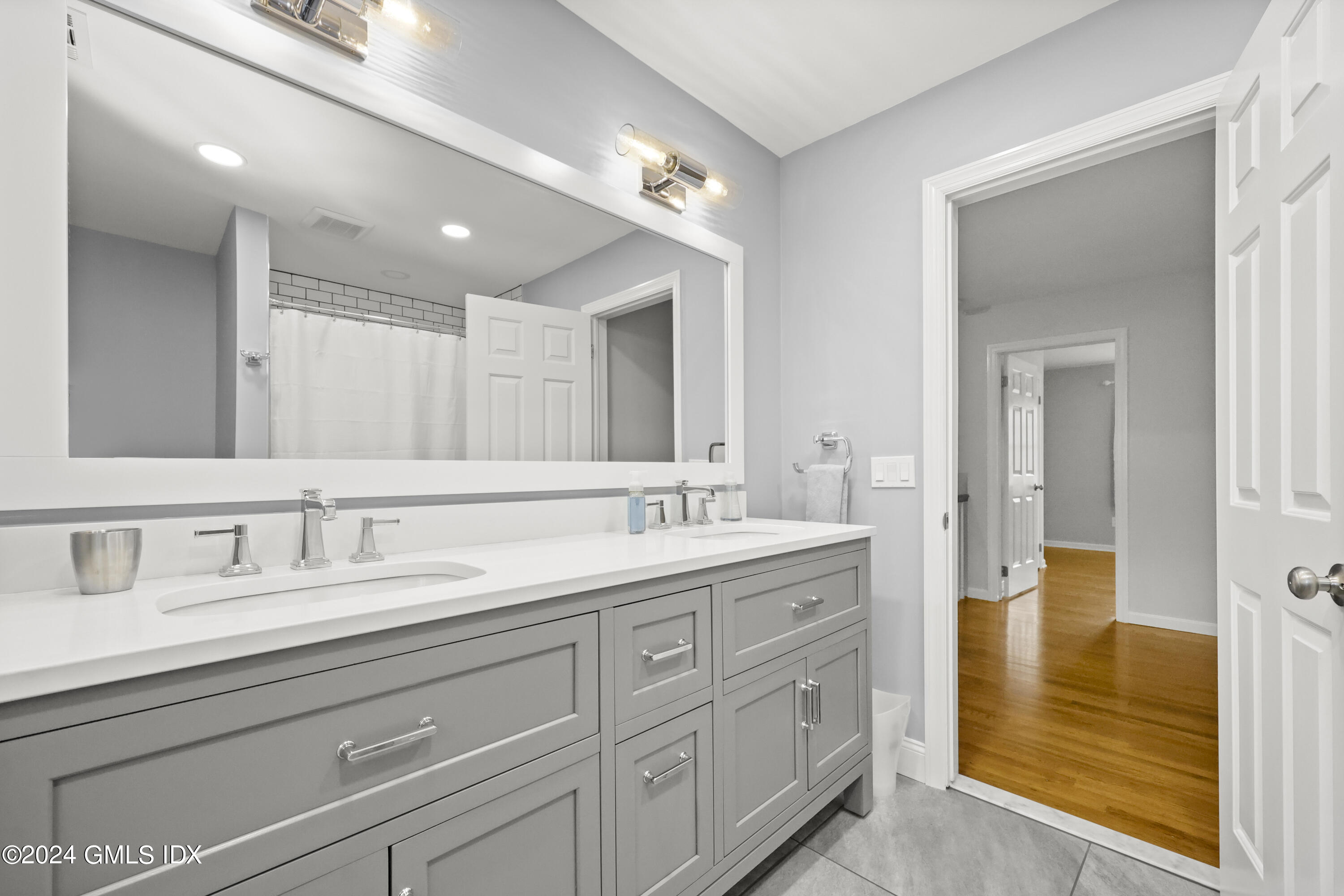 34 Loading Rock Road Riverside, CT 06878 - Photo 26 of 41 a bathroom with a granite countertop sink mirror and