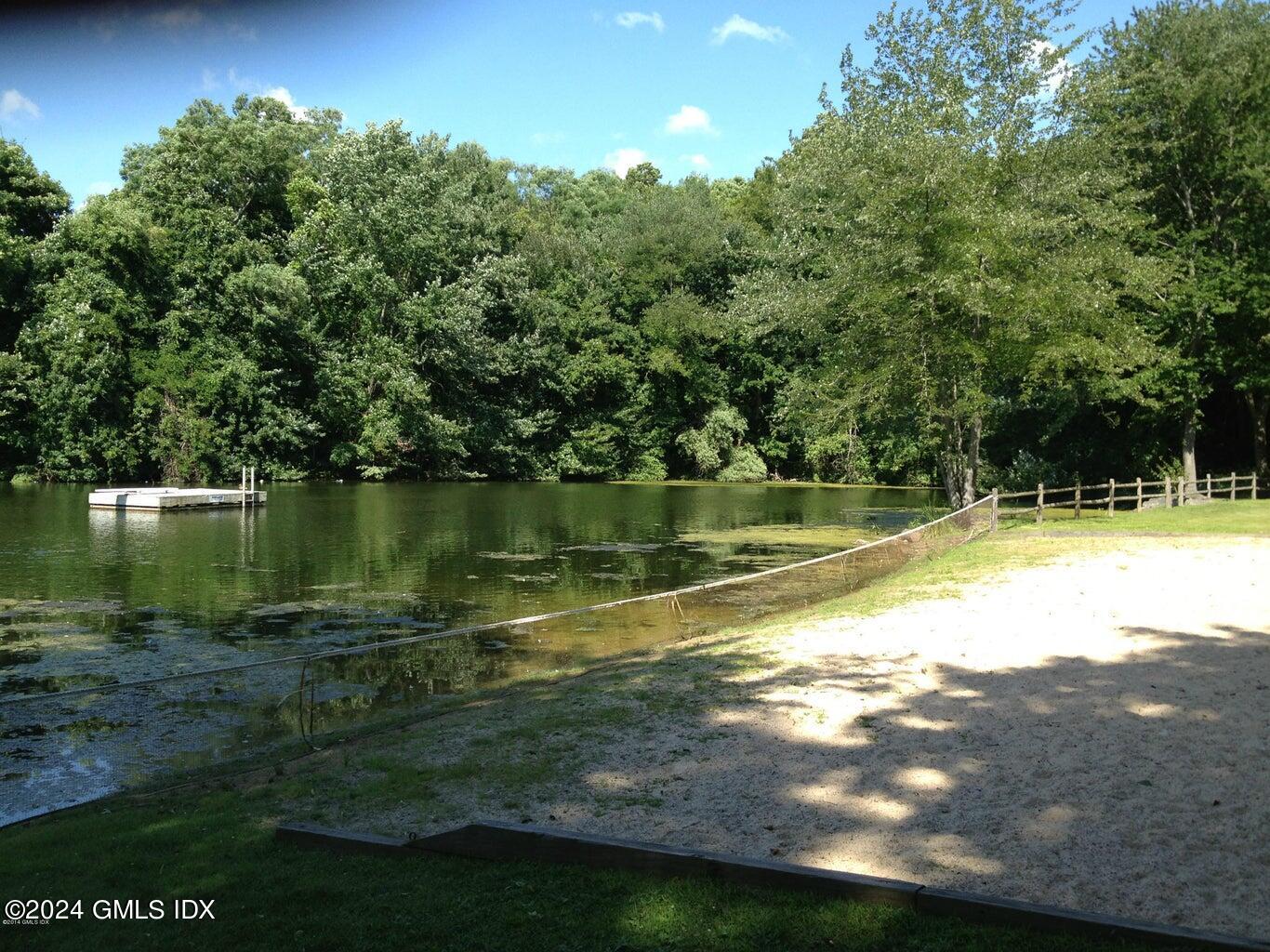34 Loading Rock Road Riverside, CT 06878 - Photo 33 of 41 a view of a swimming pool with an outdoor space and seating area