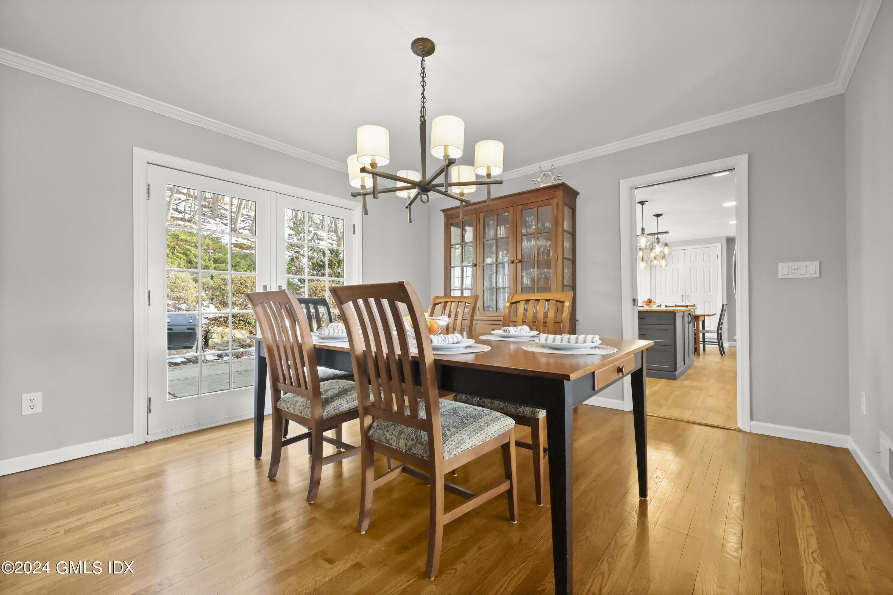 34 Loading Rock Road Riverside, CT 06878 - Photo 9 of 41 a view of a dining room with furniture window and wooden floor