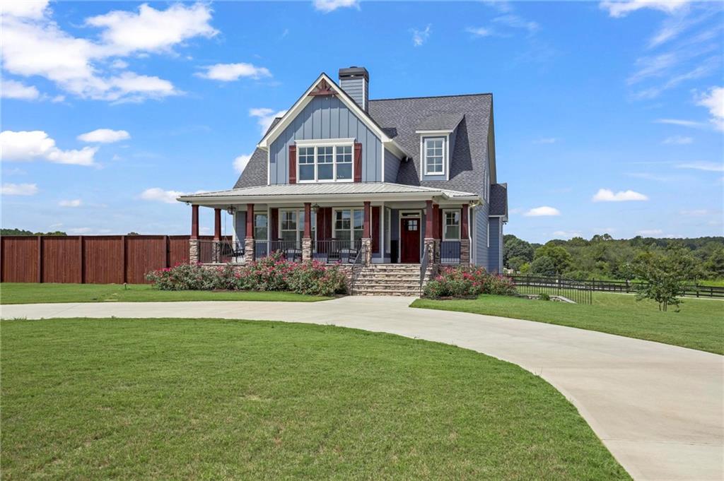 a front view of a house with a yard table and chairs
