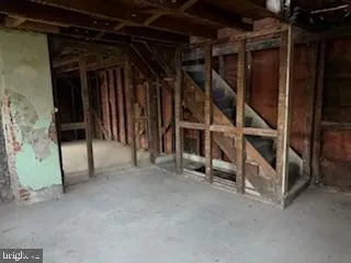 a view of an empty room with white walls