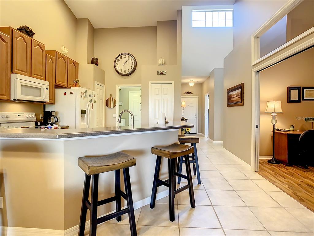2646 Rutledge Court Winter Haven, FL 33884 - Photo 5 of 23 a view of a kitchen with dining table and chairs