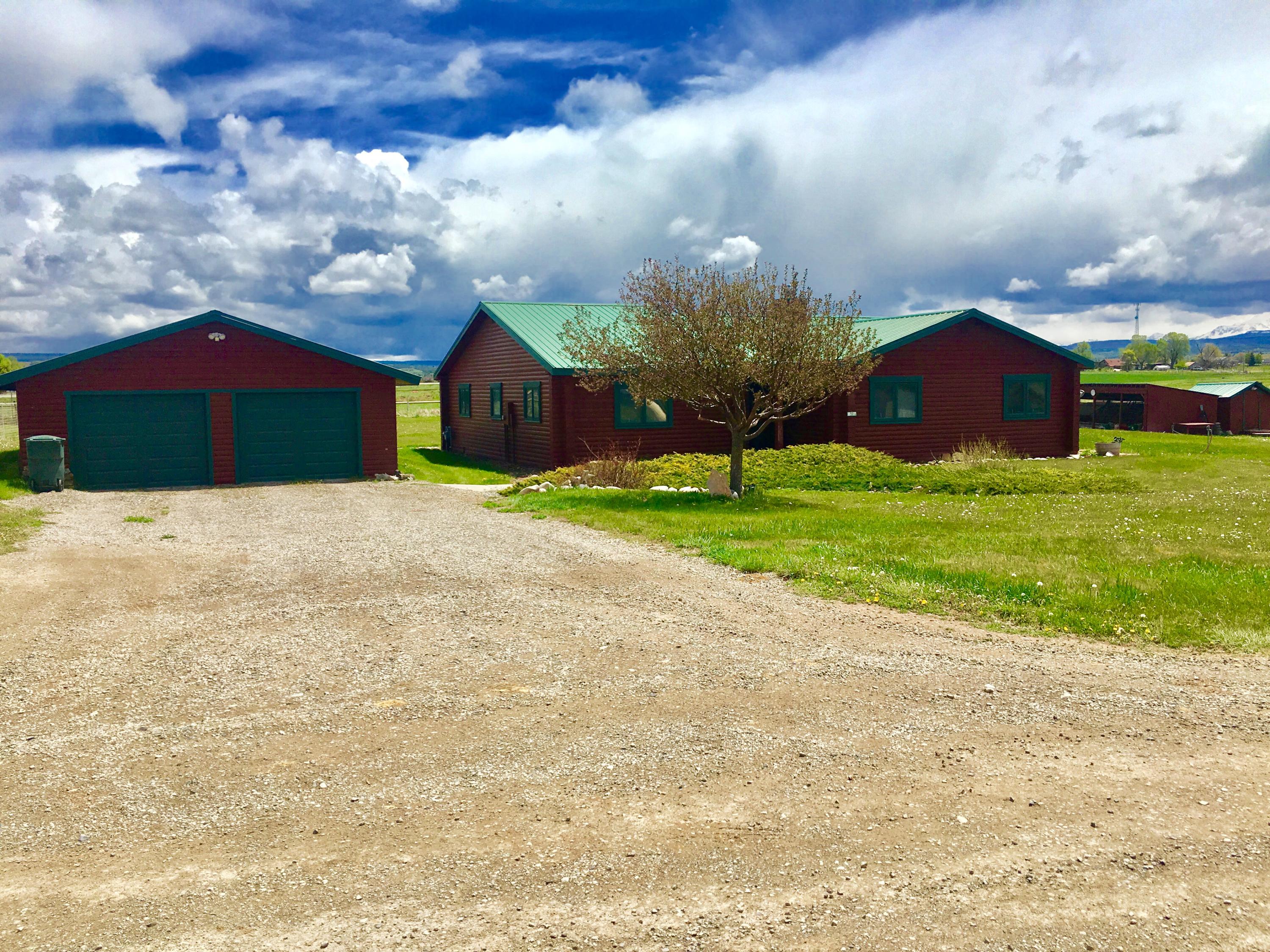 50 Homestead Road Norwood, CO 81423 - Photo 21 of 25 a house with a yard