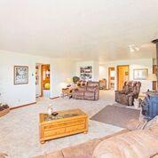 50 Homestead Road Norwood, CO 81423 - Photo 7 of 25 a spacious bedroom with furniture and a large window