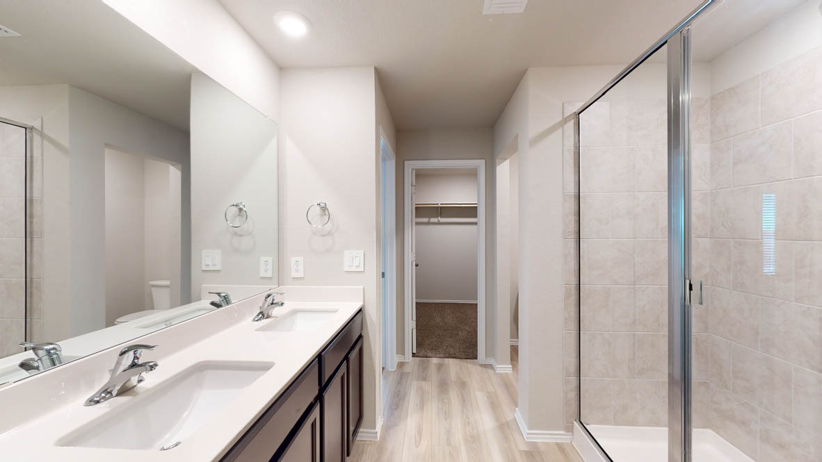 561 Hector Loop Georgetown, TX 78626 - Photo 17 of 30 a bathroom with a double vanity sink and mirror