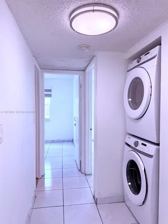 a view of a storage & utility room with washer and dryer