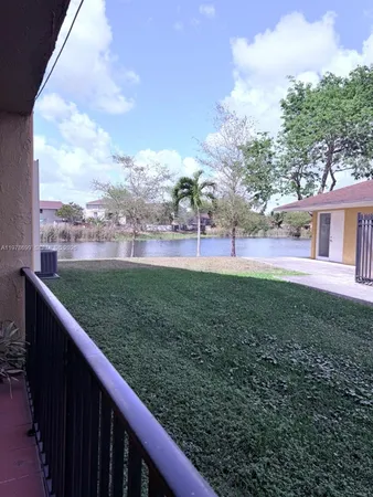 a view of outdoor space with deck and city view