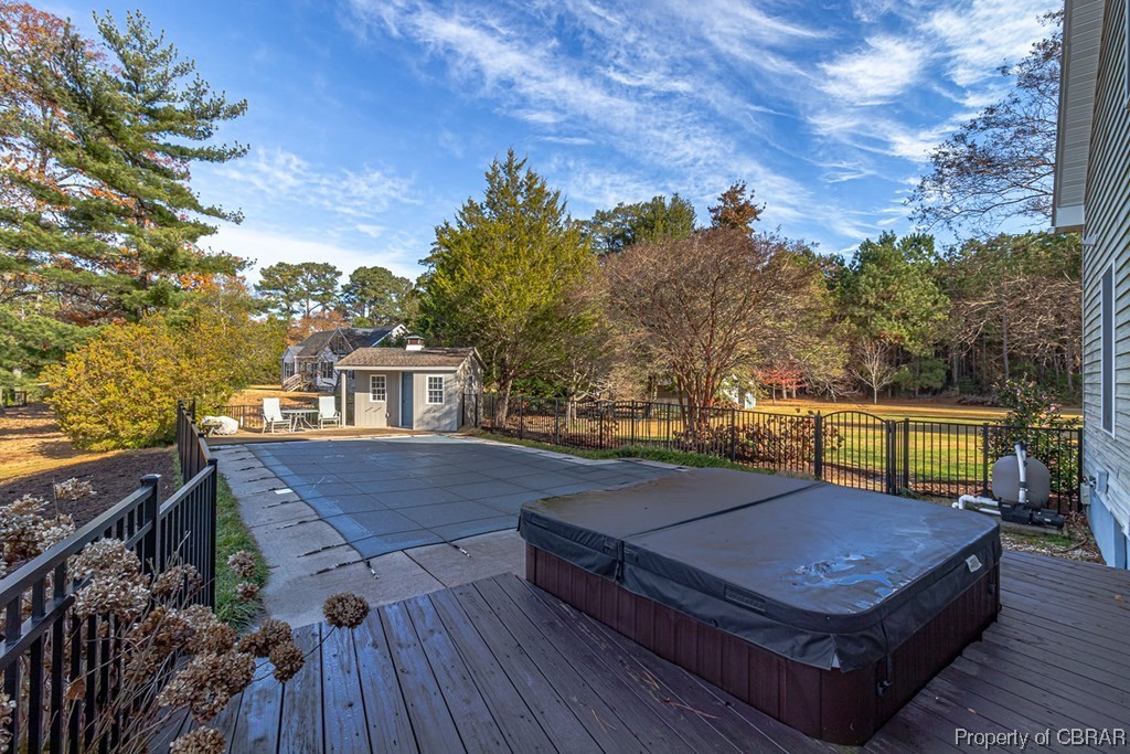 362 Beach Creek Road Lancaster, VA 22503 - Photo 30 of 47 Wooden deck with a covered hot tub and an outdoor structure