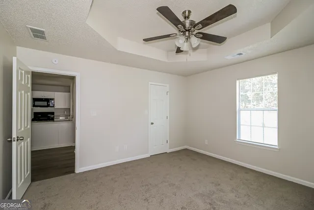 a view of an empty room with a window