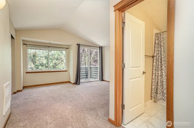 a bathroom with a sink toilet tub vanity and shower