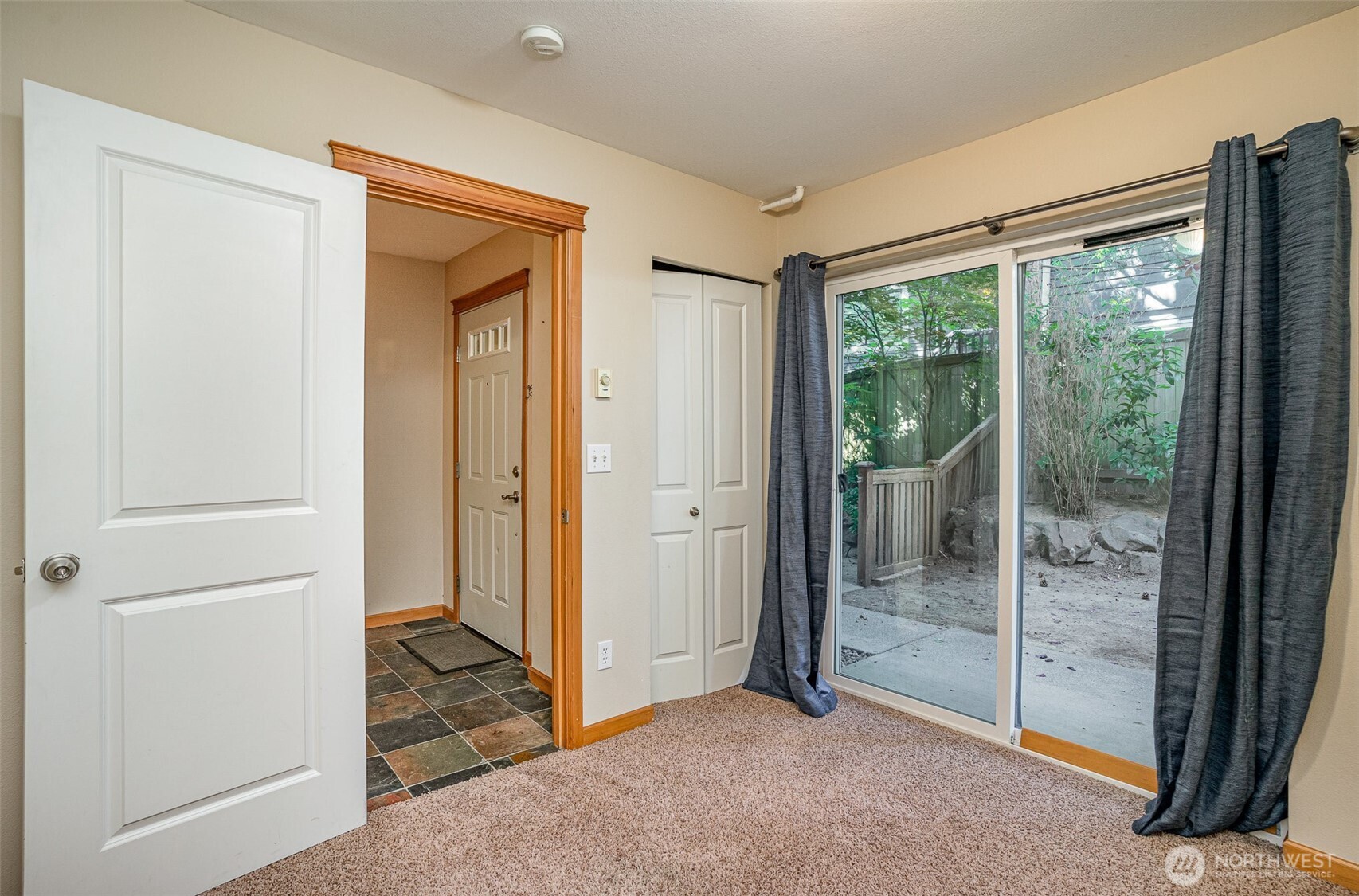 10710 Whitman Avenue North, Unit B Seattle, WA 98133 - Photo 18 of 18 a view of a room with sliding glass door