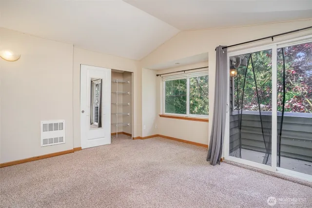 a view of empty room with floor to ceiling window