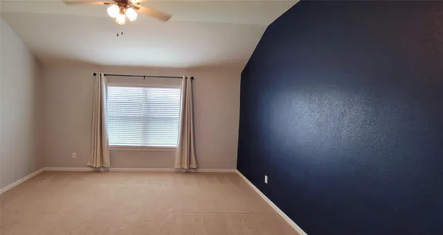 an empty room with a empty space and a window