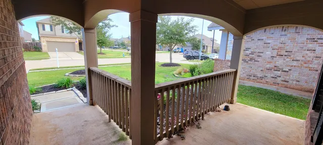 a view of a porch with a yard