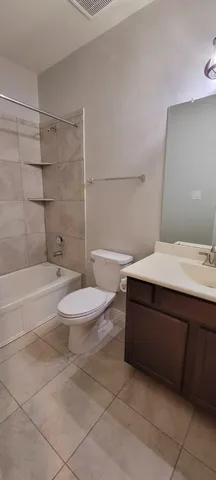 a bathroom with a bathtub and a toilet