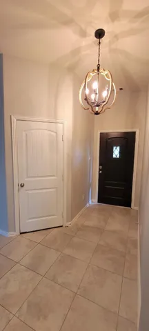 a view of empty room with a ceiling fan and window