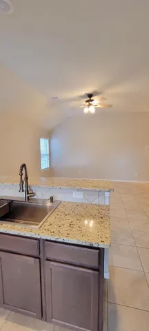 a bathroom with a sink and vanity