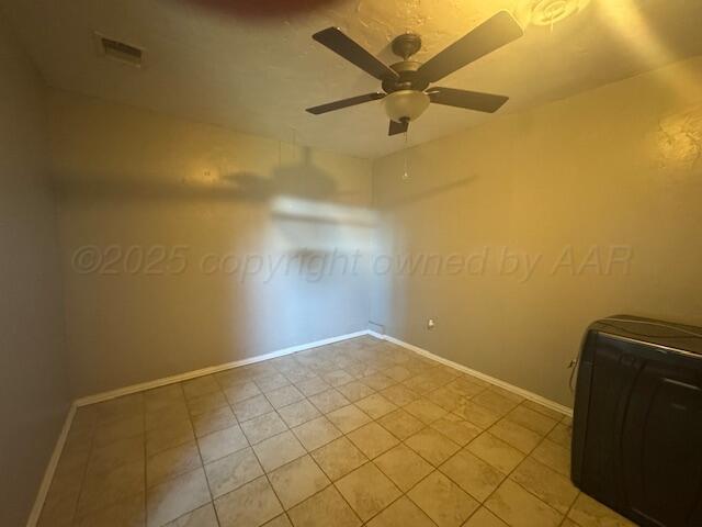 2121 Colgate Drive Perryton, TX 79070 - Photo 11 of 18 an empty room with a ceiling fan and carpet