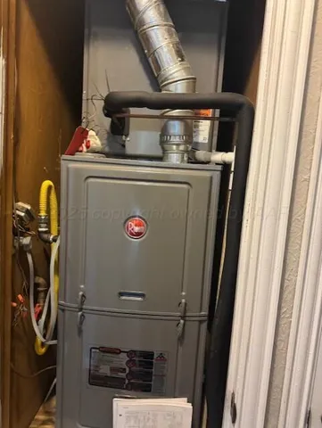 a kitchen with a stove a sink and a window