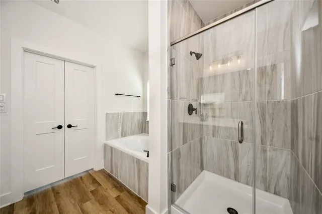 a bathroom with a shower and a sink