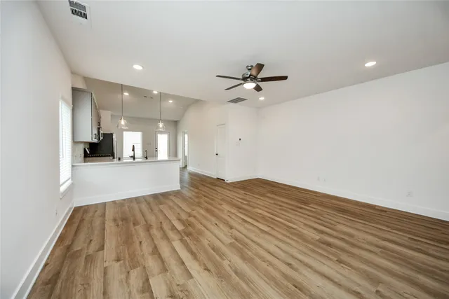 a view of a kitchen with a sink and cabinets
