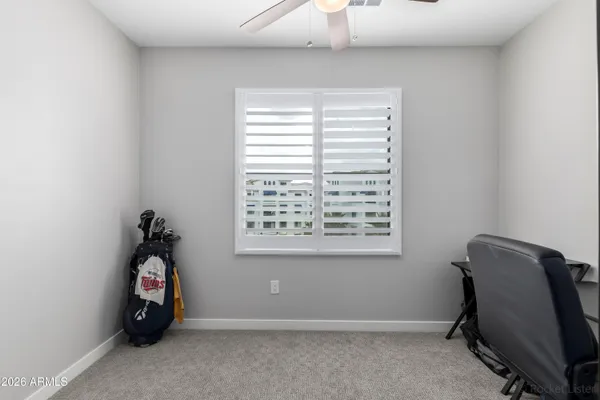 a room with a window and a chandelier