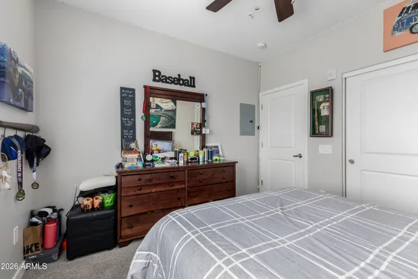 a bedroom with a bed and a dresser
