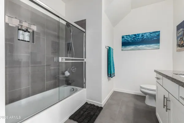 a bathroom with a bathtub and a toilet