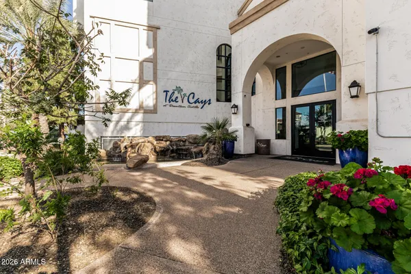 a front view of a building with flowers
